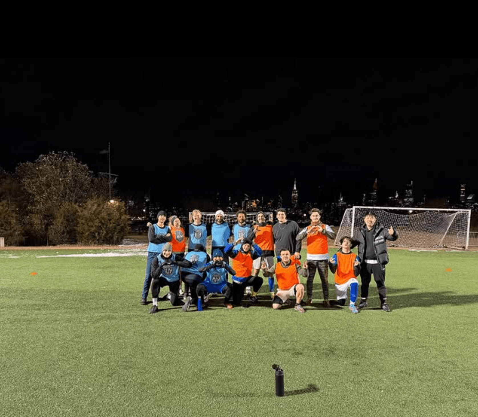 The SoccerMates squad lined up on the pitch after a night game
